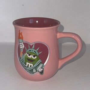 M&M'S Pink statue of Liberty and chocolate for all mug Mug with green m&m